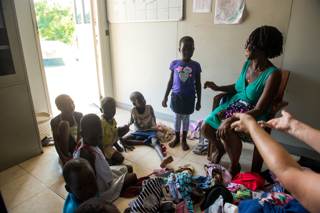 Orphans at CCC in Juba, South Sudan, try on donated clothes.